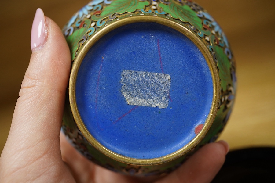 A pair of Chinese cloisonné enamel jars and covers on stands, 14cm high. Condition - good